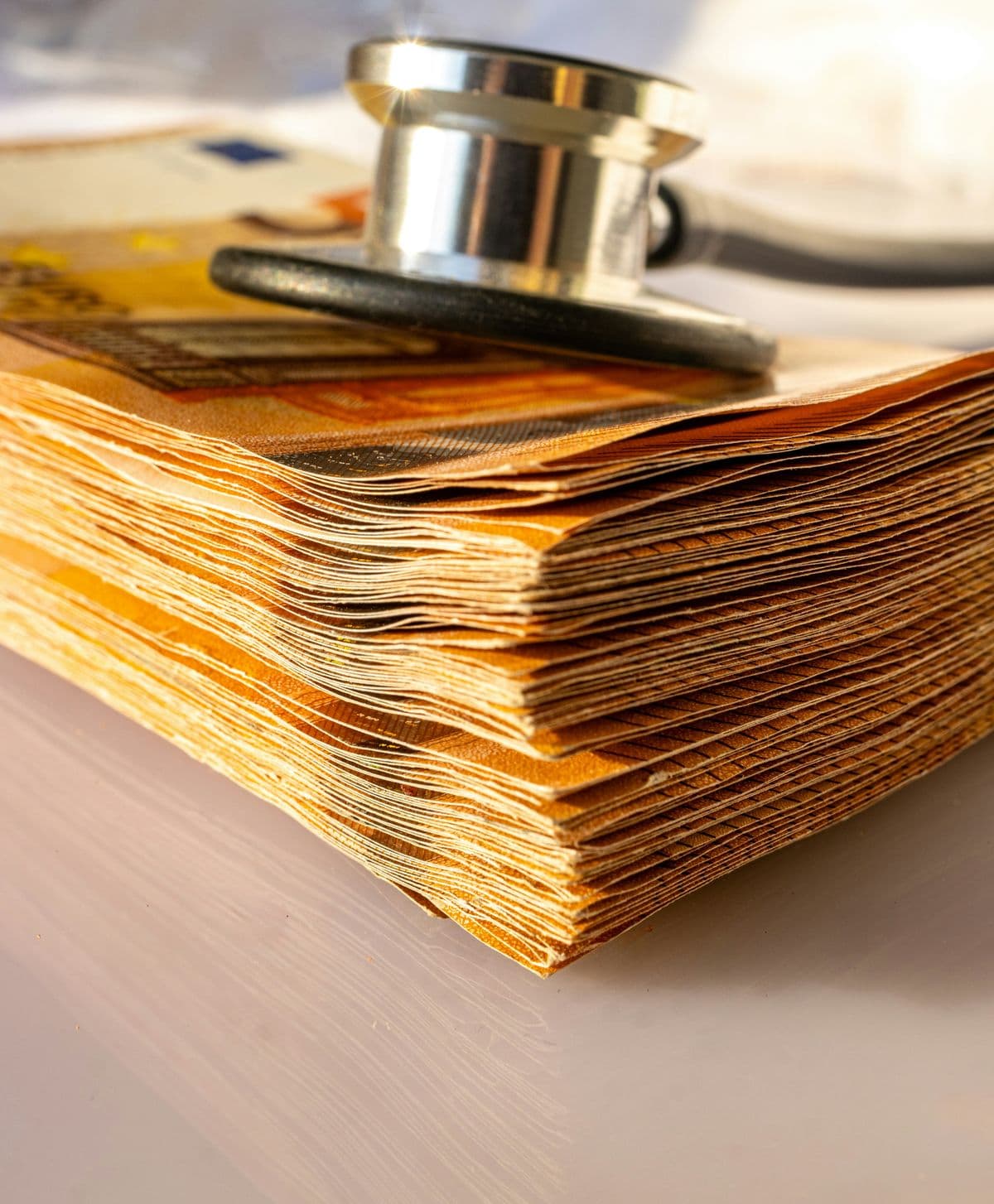 an image showing money and a stethoscope at a veterinary clinic indicating a choice between finances and care